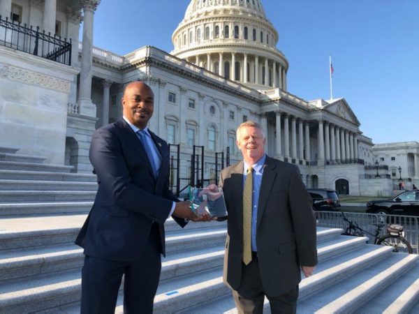 Kwanza Hall accepts term limits plaque